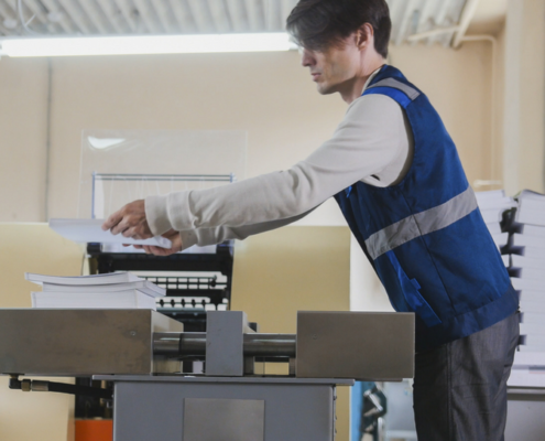 A worker using the printer