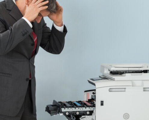 man dealing with common printer problems