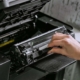 Person fixing a printer
