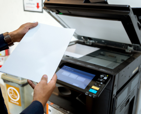 Bussiness man Hand press button on panel of printer, printer scanner laser office copy machine