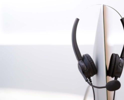 A set of headphones resting on a desk