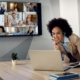 Image of a woman hosting a remote meeting on her laptop