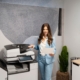 woman standing near an office printer