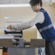 A worker using the printer