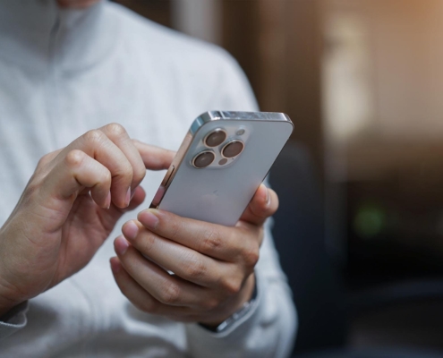 Side view of a person using their phone