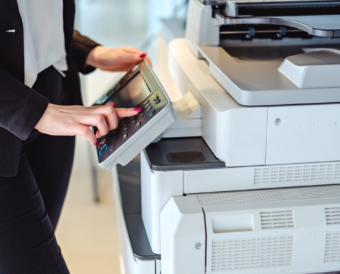 Employee using printer keypad