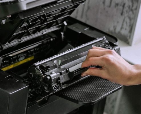 Person fixing a printer