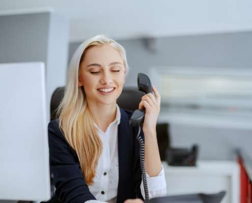 Front view of caucasian woman on phone in office