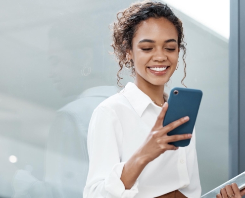 Business person with phone texting