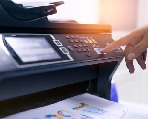 Person using multifunction printer