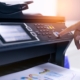 Person using multifunction printer