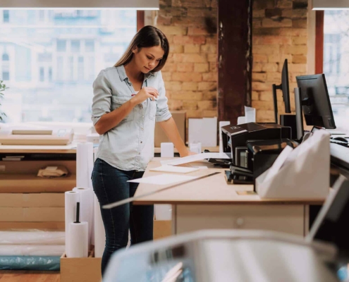 Person using printer in office