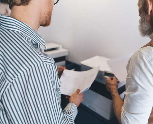 office workers at printer
